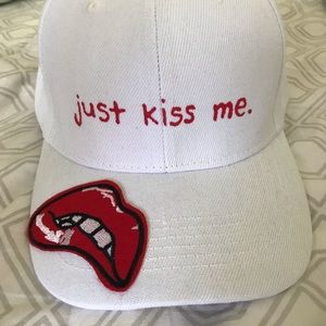 white “just kiss me” hat